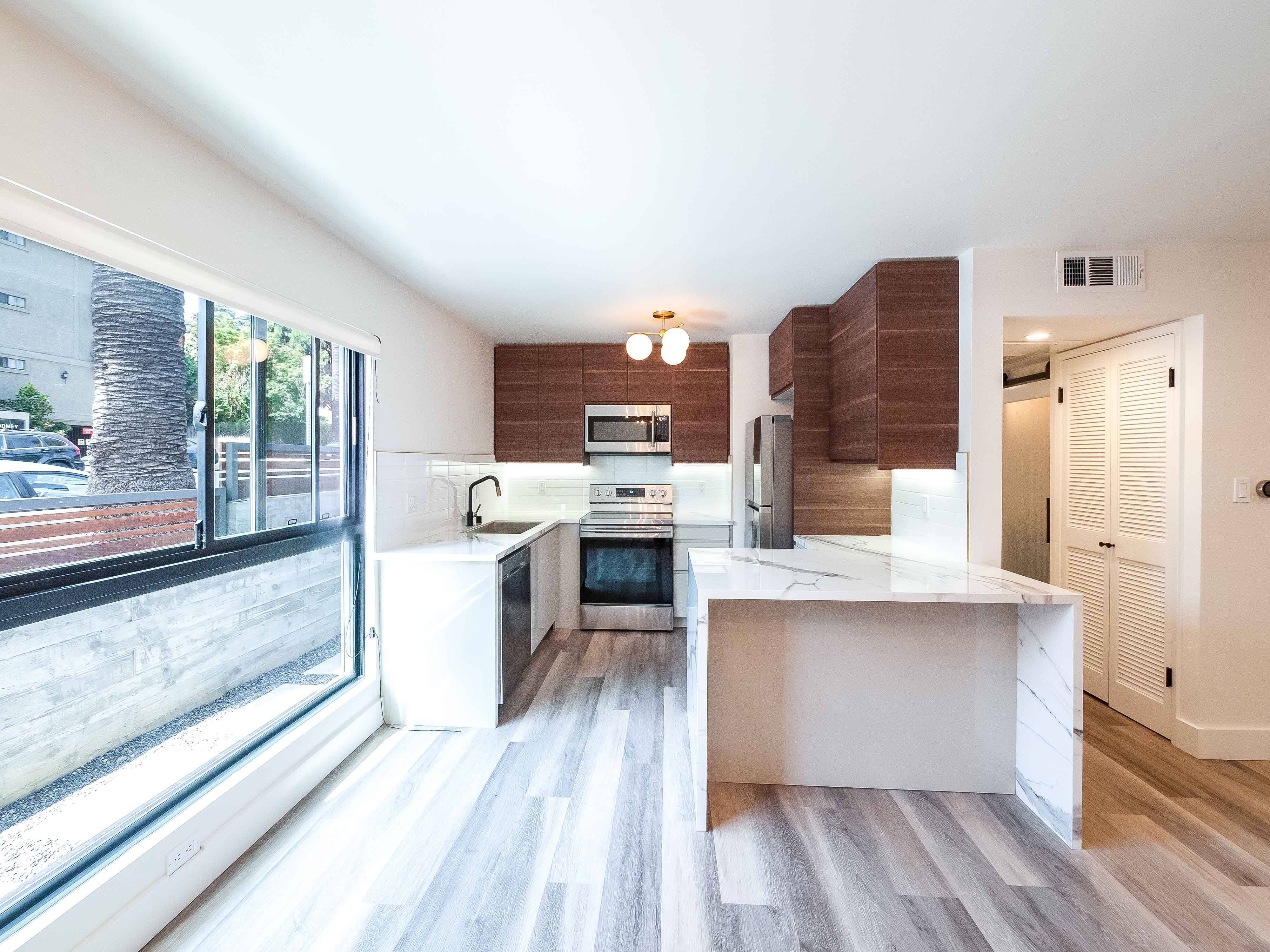 Luxurious Designer Pad | 400 Sq Ft Private Patio | High-End Upgrades| Parking + Laundry in unit | Walker's Paradise!